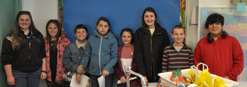 Group of smiling students in class