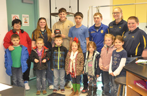 Students and adults posing together