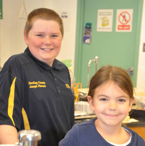 Two smiling students in class